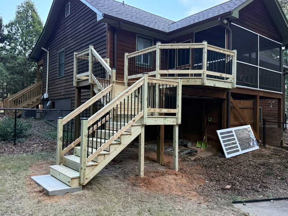 Finished multi-level deck with screened porch and white railings