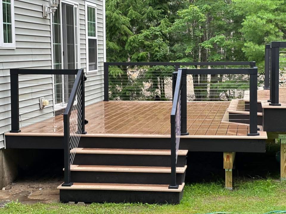 Finished deck with composite boards and cable railings