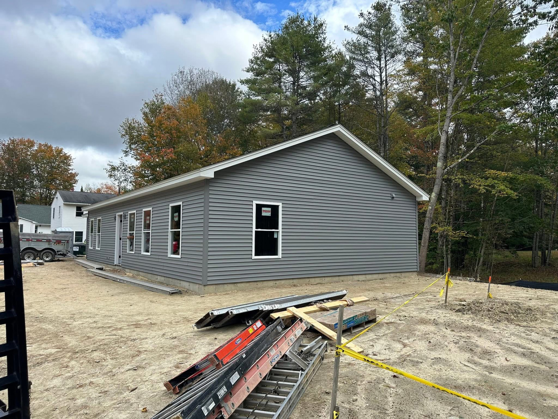 Completed home with fresh siding, trim, and windows